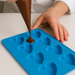 Chocolate being poured in Heart Silicone Mould