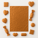 Copper 7x10 inch aluminum foil sheet with assorted shaped chocolates wrapped in matching foil