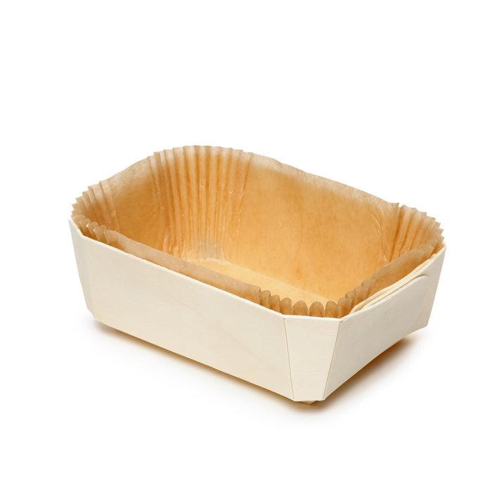Empty Panibois Prince wooden baking mold with natural paper lining on white background