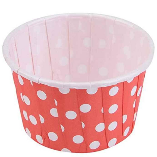 Red polka dot paper cupcake baking cup with a pleated design, ideal for serving cupcakes or desserts